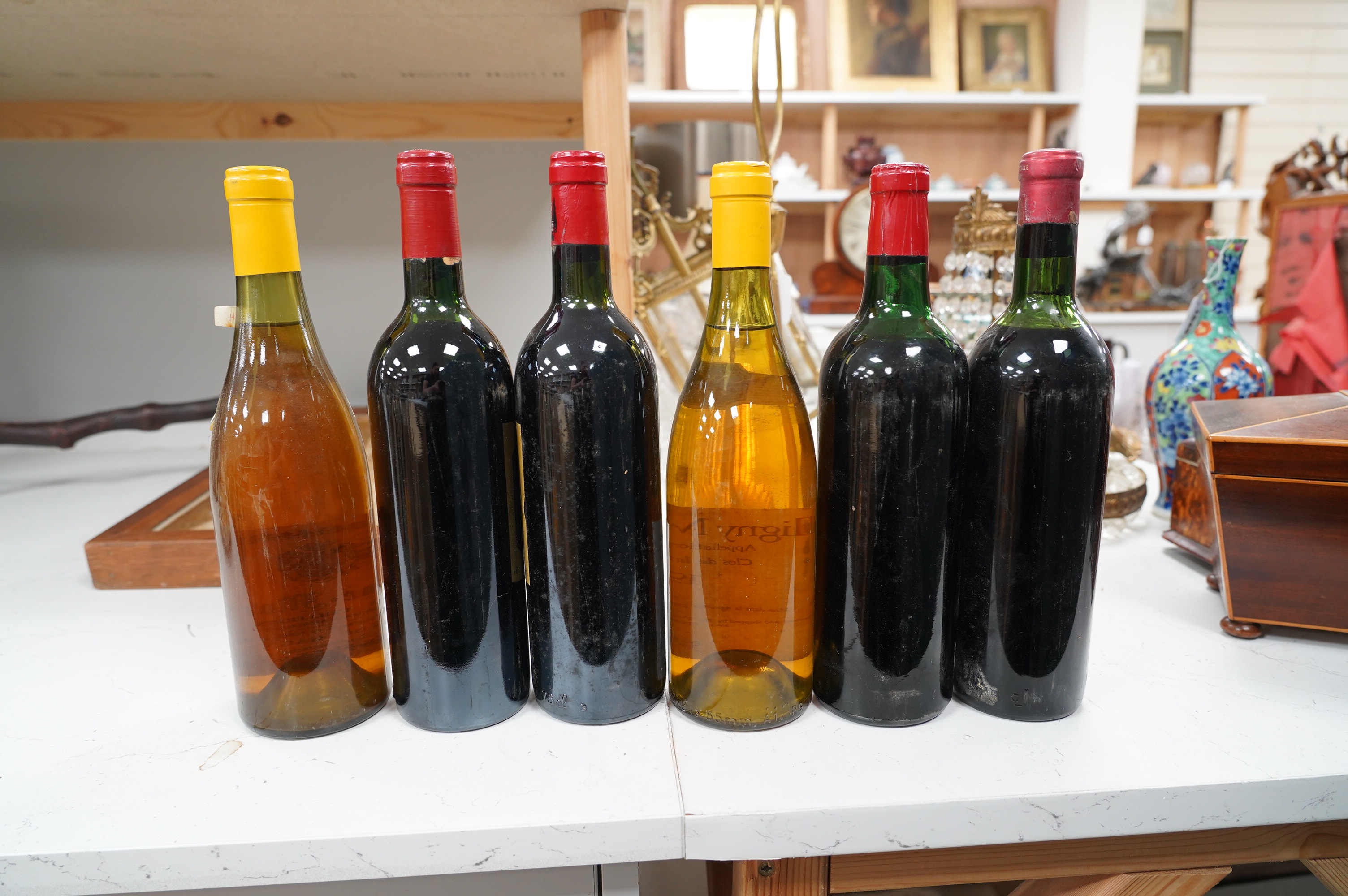 Six bottles of mixed wines: Chateau Ducru-Beaucaillow Saint Julien 1977, Grand-Puy Ducasse Pauillac 1959, Chateau Larcis Ducasse Saint-Emilion Grand Cru, 1982 and three other wines